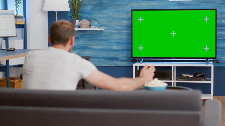 Sports fan watching live NFL game on Gamma IPTV