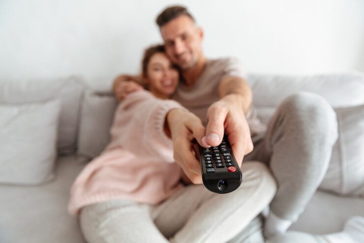 Couple enjoying reliable streaming on Gamma IPTV service