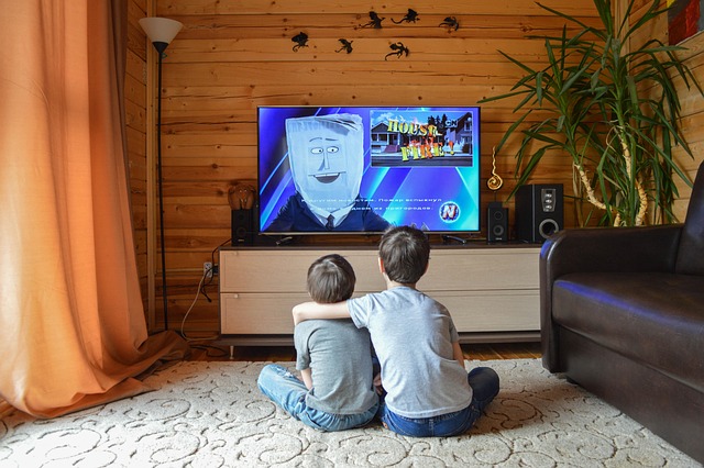 Family watching TV together after installing Nordic IPTV on a smart TV